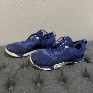 Under Amour lady’s size 8.5. Cobalt blue color.